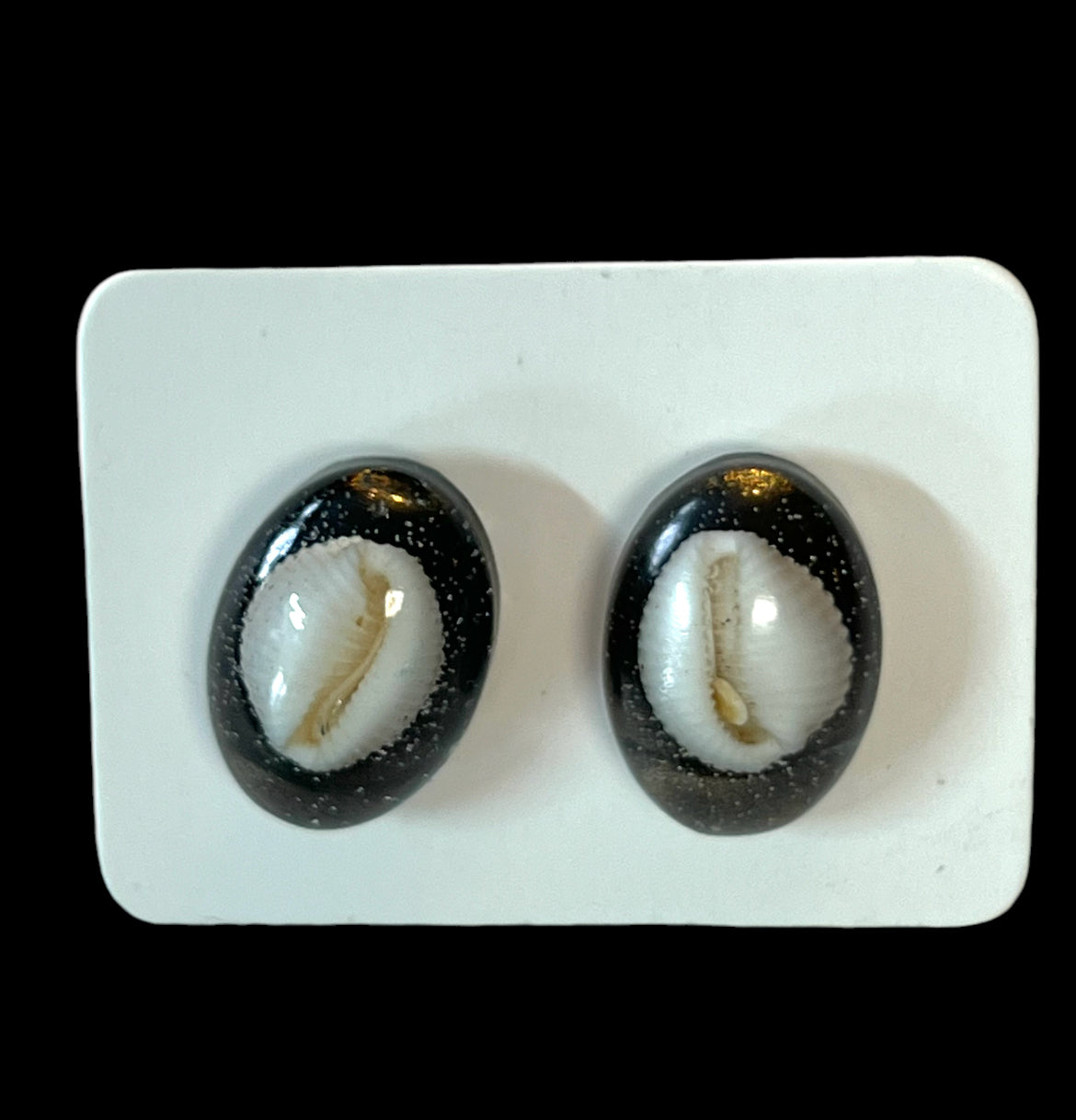 Cowrie Shell studs.