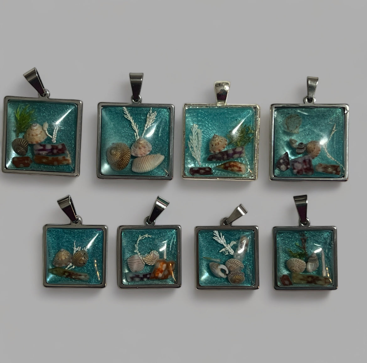 Sea blue beach treasure pendants.